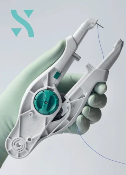 Robotic hand holding a surgical dental device with turquoise circular interface and blue cord attachment
